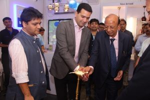 Mr. Sumit Padmakar Joshi, CEO, Signify Innovations India Ltd. lighting lamp at the launch of 7th Smart Hub in Kolkata
